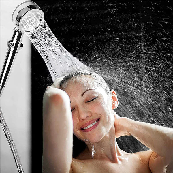 Person enjoying a shower with water spraying from a showerhead.